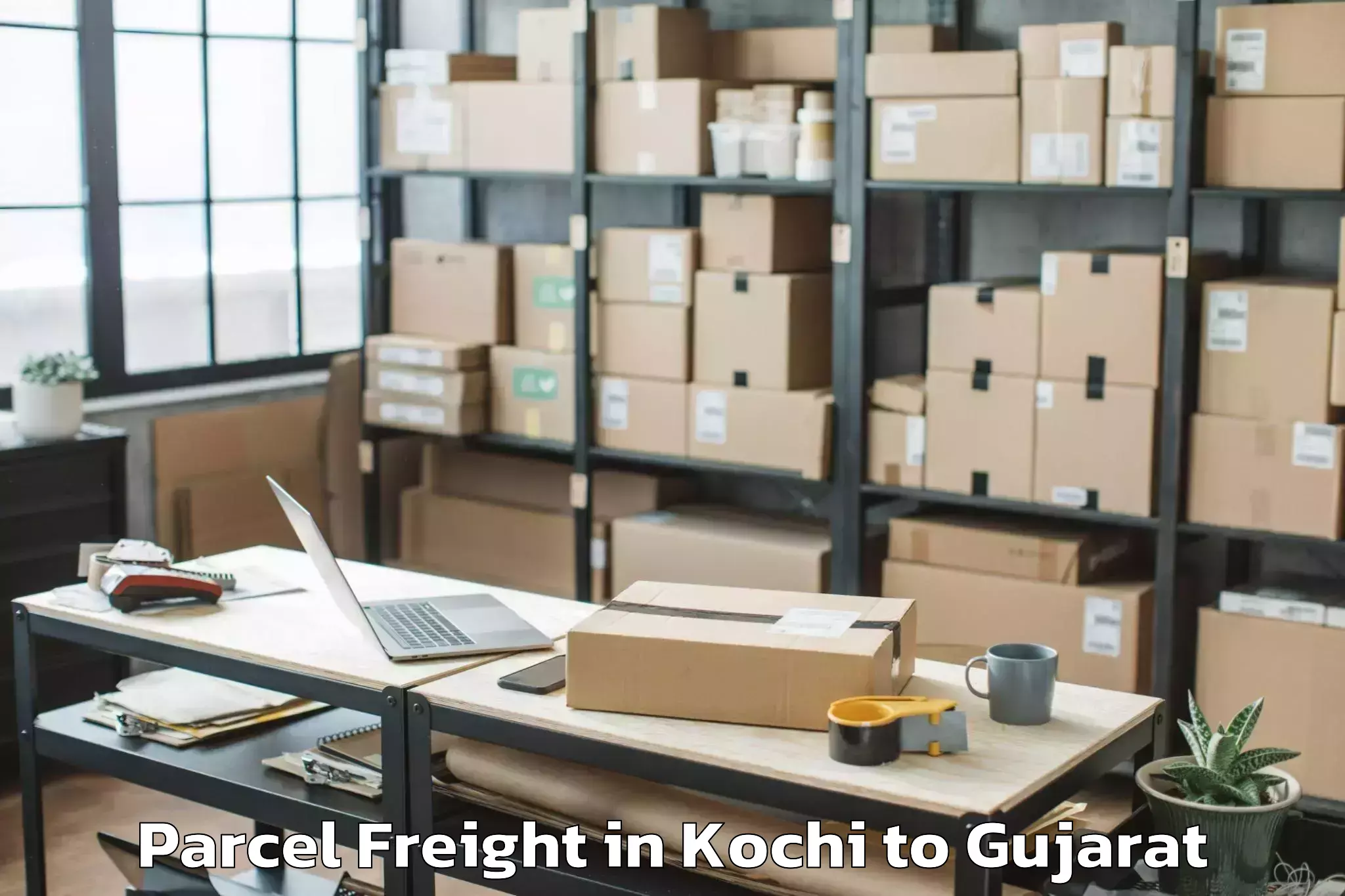 Book Kochi to Netrang Parcel Freight Online